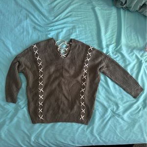 Criss cross detailed dark green sweater